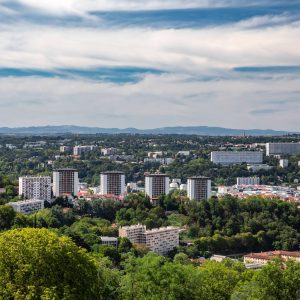 Aerial view of the suburbs of Lyon French city with some skyscrapers and apartments in middle of nature